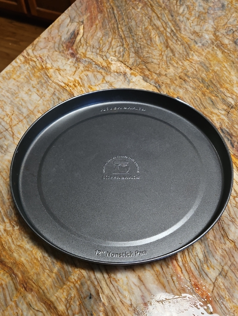 KitchenAid 12-inch round nonstick pan with a dark gray finish.